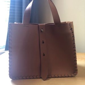 Charming Charlie cute small purse. Cognac color